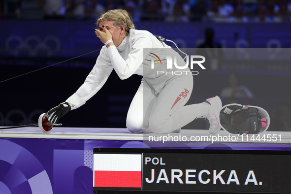 Aleksandra Jarecka,  is  celebrating  victory after the bronze medal match in women's 11 rowing between the Polish national team and the Chi...