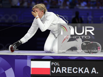 Aleksandra Jarecka,  is  celebrating  victory after the bronze medal match in women's 11 rowing between the Polish national team and the Chi...