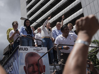 Opponents of Venezuelan President Nicolas Maduro are displaying a Venezuelan flag during a rally called by presidential candidate Edmundo Go...