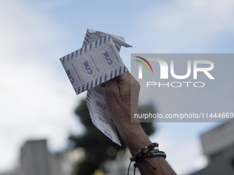 Opponents of Venezuelan President Nicolas Maduro are displaying a Venezuelan flag during a rally called by presidential candidate Edmundo Go...