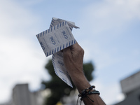 Opponents of Venezuelan President Nicolas Maduro are displaying a Venezuelan flag during a rally called by presidential candidate Edmundo Go...