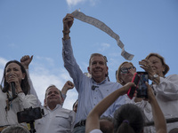 Opponents of Venezuelan President Nicolas Maduro are displaying a Venezuelan flag during a rally called by presidential candidate Edmundo Go...