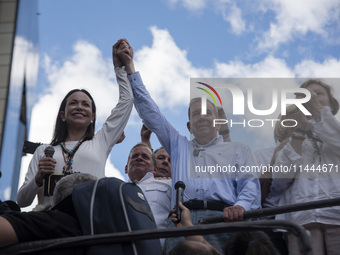 Opponents of Venezuelan President Nicolas Maduro are displaying a Venezuelan flag during a rally called by presidential candidate Edmundo Go...