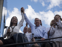 Opponents of Venezuelan President Nicolas Maduro are displaying a Venezuelan flag during a rally called by presidential candidate Edmundo Go...