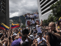 Opponents of Venezuelan President Nicolas Maduro are displaying a Venezuelan flag during a rally called by presidential candidate Edmundo Go...