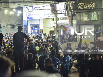 Ambulances are following an Israeli military strike on a building in Beirut's southern suburb, in Beirut, Lebanon, on July 30, 2024. The Isr...