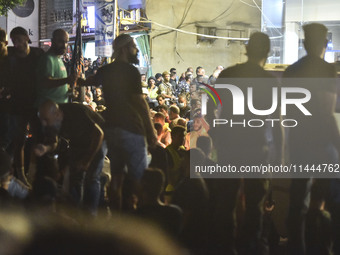 Ambulances are following an Israeli military strike on a building in Beirut's southern suburb, in Beirut, Lebanon, on July 30, 2024. The Isr...