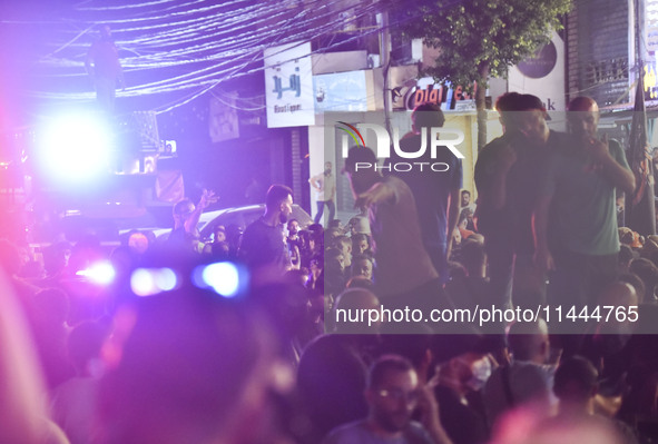 Ambulances are following an Israeli military strike on a building in Beirut's southern suburb, in Beirut, Lebanon, on July 30, 2024. The Isr...