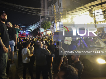 Ambulances are following an Israeli military strike on a building in Beirut's southern suburb, in Beirut, Lebanon, on July 30, 2024. The Isr...