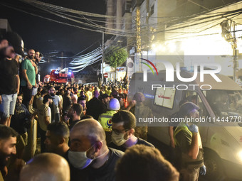 Ambulances are following an Israeli military strike on a building in Beirut's southern suburb, in Beirut, Lebanon, on July 30, 2024. The Isr...