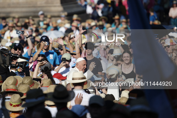 Pope Francis is arriving in St. Peter's Square to meet with priests and altar servers at the Vatican, on July 30, 2024. 