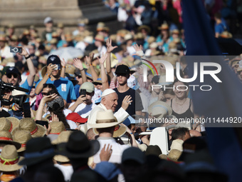 Pope Francis is arriving in St. Peter's Square to meet with priests and altar servers at the Vatican, on July 30, 2024. (