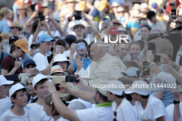 Pope Francis is arriving in St. Peter's Square to meet with priests and altar servers at the Vatican, on July 30, 2024. 