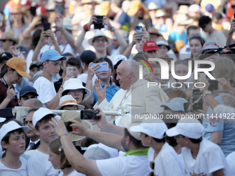 Pope Francis is arriving in St. Peter's Square to meet with priests and altar servers at the Vatican, on July 30, 2024. (