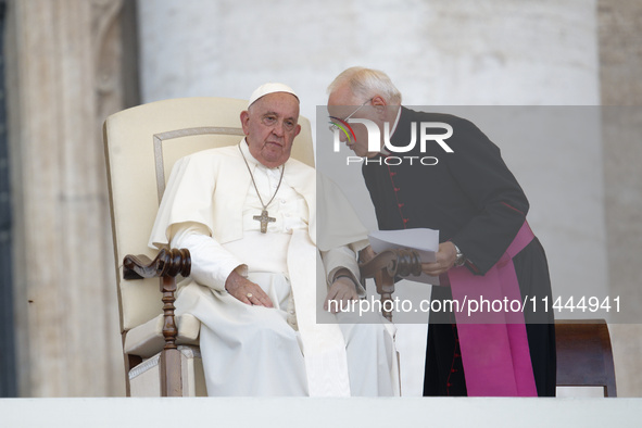 Pope Francis is talking with Padre Leonardo Sapienza during an open-air audience of the XIII International Pilgrimage of Altar Servers at St...