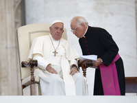 Pope Francis is talking with Padre Leonardo Sapienza during an open-air audience of the XIII International Pilgrimage of Altar Servers at St...