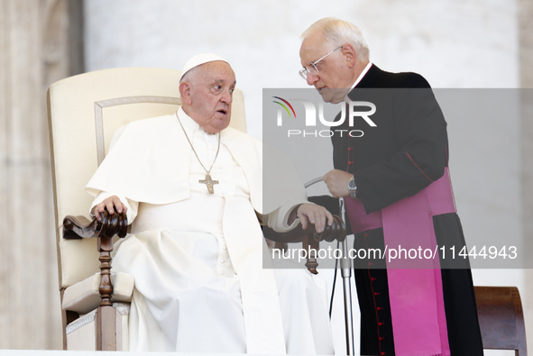 Pope Francis is talking with Padre Leonardo Sapienza during an open-air audience of the XIII International Pilgrimage of Altar Servers at St...