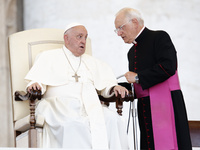 Pope Francis is talking with Padre Leonardo Sapienza during an open-air audience of the XIII International Pilgrimage of Altar Servers at St...