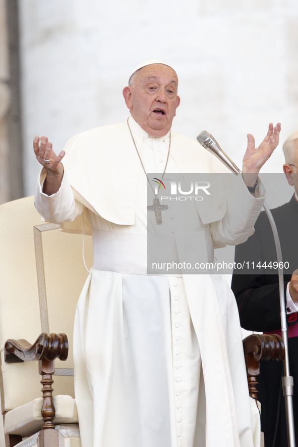 Pope Francis is gesturing during an open-air audience of the XIII International Pilgrimage of Altar Servers at St. Peter's Square in the Vat...