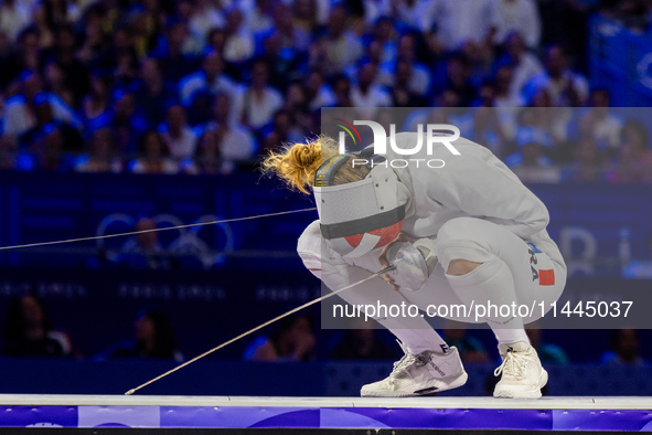 Auriane Mallo-Breton of Team France react after losing the Fencing Women's Epee Team Gold Medal match between Team France and Team Ital on d...