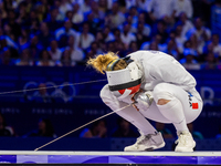 Auriane Mallo-Breton of Team France react after losing the Fencing Women's Epee Team Gold Medal match between Team France and Team Ital on d...