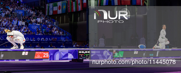 Auriane Mallo-Breton of Team France and Alberta Santuccio of Team Italy are reacting  after  the Fencing Women's Epee Team Gold Medal match...