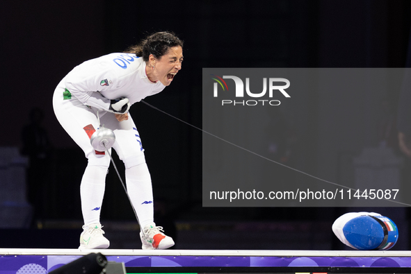 Alberta Santuccio of Team Italy celebrates winning the Fencing Women's Epee Team Gold Medal match between Team France and Team Ital on day f...