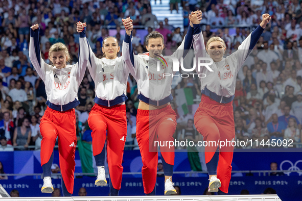 Bronze medalists Aleksandra Klasik,  Martyna Swatowska-Weglarczyk,Renata Knapik-Miazga and  Aleksandra Jarecka of Team Poland pose on the po...