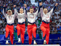 Bronze medalists Aleksandra Klasik,  Martyna Swatowska-Weglarczyk,Renata Knapik-Miazga and  Aleksandra Jarecka of Team Poland pose on the po...