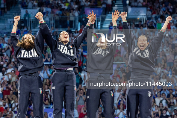 Gold medalists of Team Italy celebrate on the podium during the Fencing Women's Epee medal ceremony on day four of the Olympic Games Paris 2...