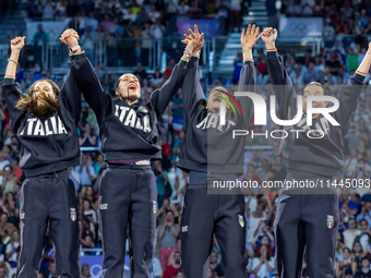 Gold medalists of Team Italy celebrate on the podium during the Fencing Women's Epee medal ceremony on day four of the Olympic Games Paris 2...