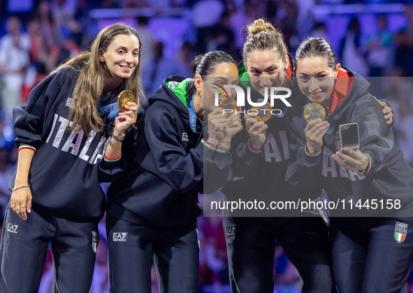 Gold medalists of Team Italy celebrate on the podium during the Fencing Women's Epee medal ceremony on day four of the Olympic Games Paris 2...