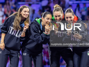 Gold medalists of Team Italy celebrate on the podium during the Fencing Women's Epee medal ceremony on day four of the Olympic Games Paris 2...