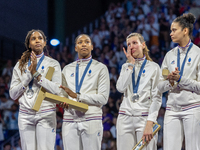 Silver medalists of Team France celebrate on the podium during the Fencing Women's Epee medal ceremony on day four of the Olympic Games Pari...