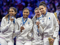 Silver medalists of Team France celebrate on the podium during the Fencing Women's Epee medal ceremony on day four of the Olympic Games Pari...