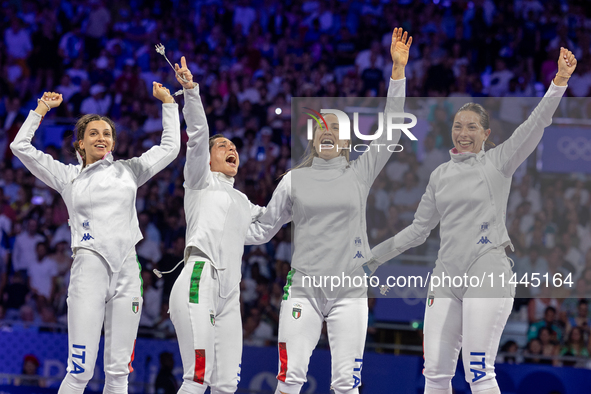  Team Italy celebrate on the podium during the Fencing Women's Epee medal ceremony on day four of the Olympic Games Paris 2024 at Grand Pala...