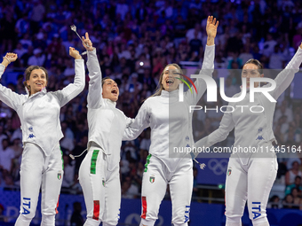  Team Italy celebrate on the podium during the Fencing Women's Epee medal ceremony on day four of the Olympic Games Paris 2024 at Grand Pala...