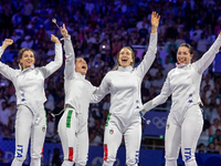  Team Italy celebrate on the podium during the Fencing Women's Epee medal ceremony on day four of the Olympic Games Paris 2024 at Grand Pala...