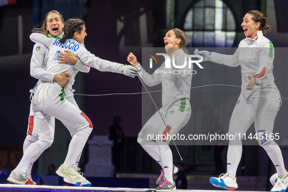  Team Italy celebrate victory during the Fencing Women's Epee Team Gold Medal match between Team France and Team Ital on day four of the Oly...