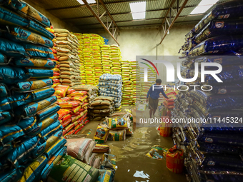 A shop is being partially submerged in Kathmandu, Nepal, on July 31, 2024. (