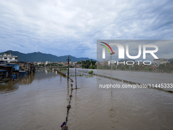 Flooding is submerging a section of road in Kathmandu, Nepal, on July 31, 2024. (