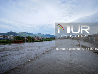 Flooding is submerging a section of road in Kathmandu, Nepal, on July 31, 2024. (