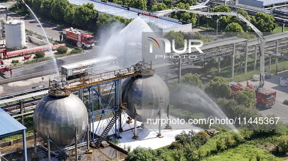 Firefighters are performing a rescue drill at a chemical plant amid high temperatures in Huai'an, China, on July 31, 2024. 