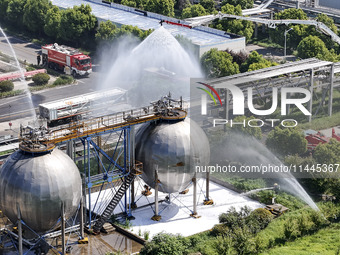 Firefighters are performing a rescue drill at a chemical plant amid high temperatures in Huai'an, China, on July 31, 2024. (