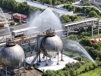 Firefighters are performing a rescue drill at a chemical plant amid high temperatures in Huai'an, China, on July 31, 2024. (