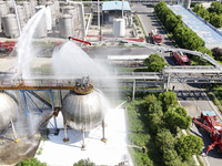 Firefighters are performing a rescue drill at a chemical plant amid high temperatures in Huai'an, China, on July 31, 2024. (