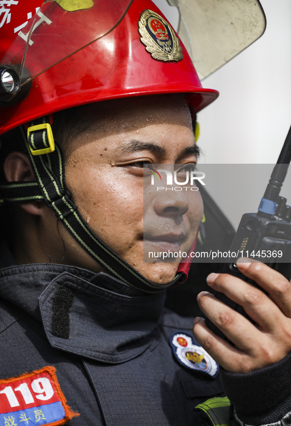 Firefighters are performing a rescue drill at a chemical plant amid high temperatures in Huai'an, China, on July 31, 2024. 