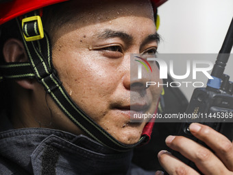 Firefighters are performing a rescue drill at a chemical plant amid high temperatures in Huai'an, China, on July 31, 2024. (