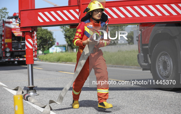 Firefighters are performing a rescue drill at a chemical plant amid high temperatures in Huai'an, China, on July 31, 2024. 