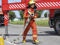 Firefighters are performing a rescue drill at a chemical plant amid high temperatures in Huai'an, China, on July 31, 2024. (